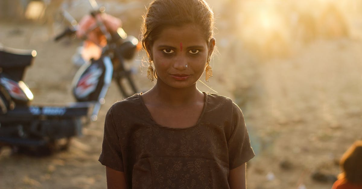 indian railway child issue [duplicate] - Woman in Brown Scoop-neck T-shirt