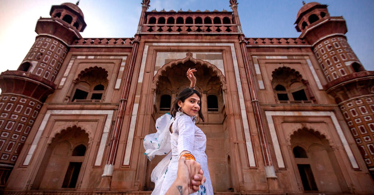 Indian tourist visa - Woman Wearing White Dress Standing Near Building