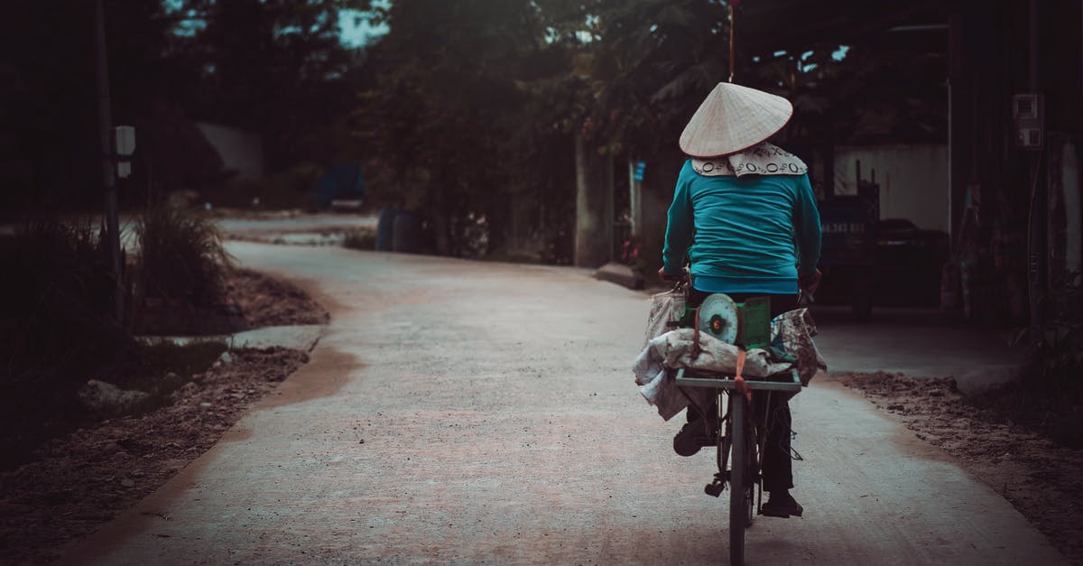 Indian travelling by road through Cambodia, Laos and Vietnam - Person Riding a Bicycle Cycling on Road