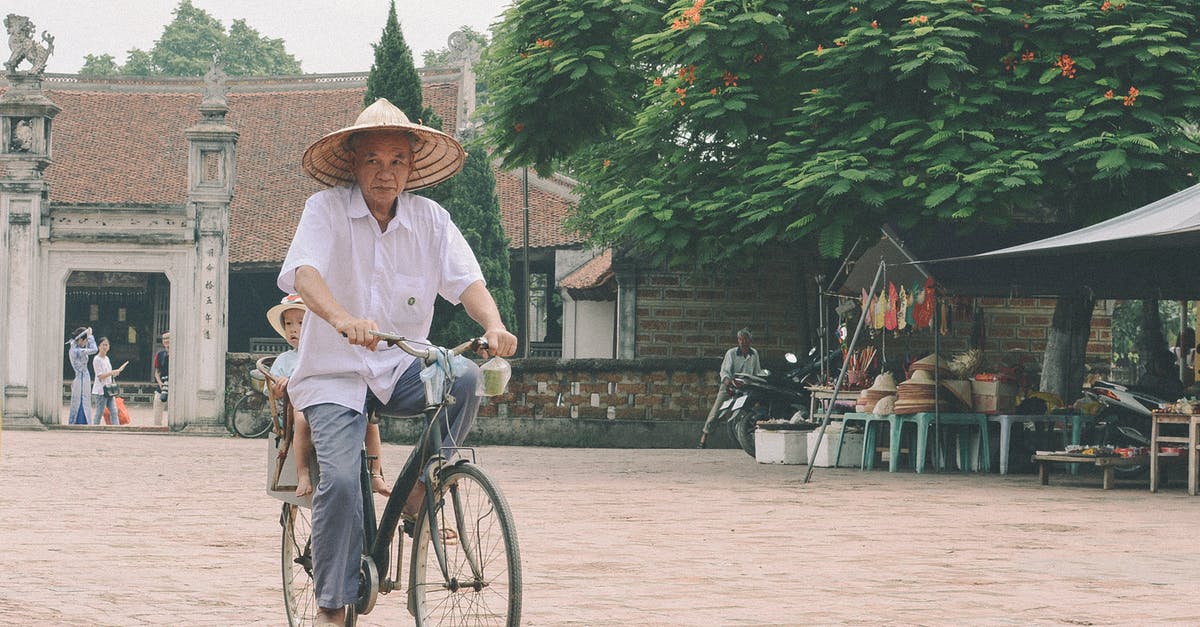 Indian travelling by road through Cambodia, Laos and Vietnam - Man Riding Bike