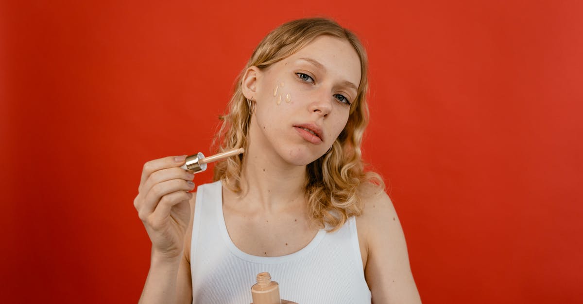 In-person Schengen visa application: is cover letter necessary? - Woman in White Tank Top Holding Glass Container with Brown Cream