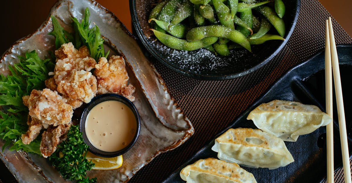 insider restaurant tip for traditional cuisine in Vienna [closed] - Dumplings on Black Plate Beside Green Beans and Fried Food