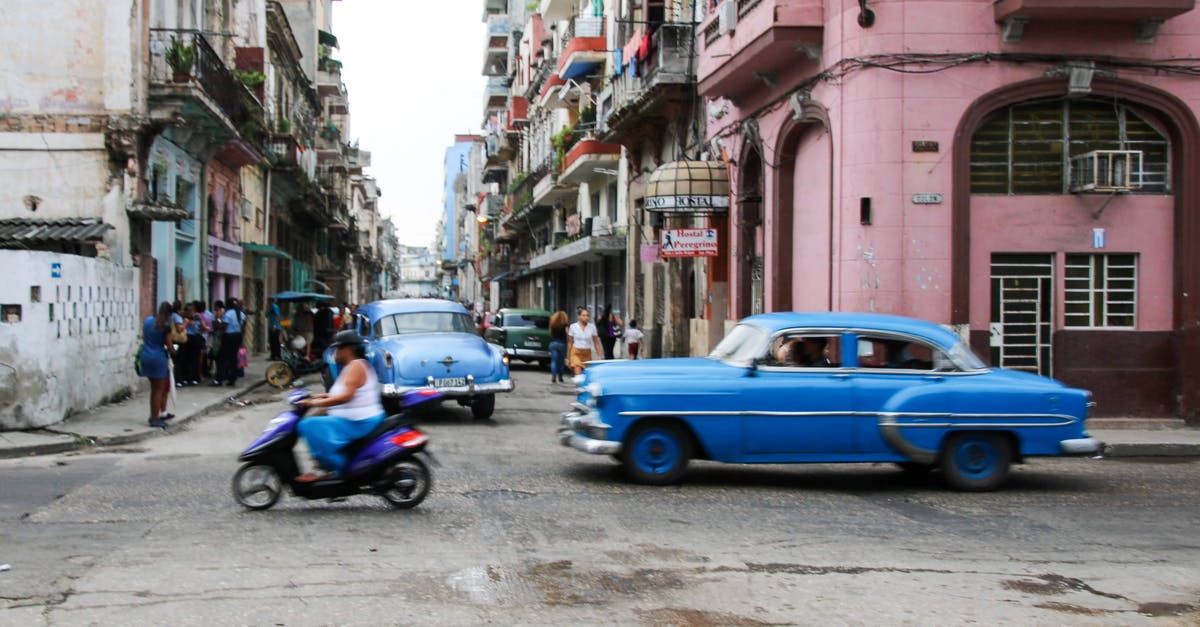 Intercity transportation in Cuba - Blue Sedan Parked Beside Blue Sedan on Street