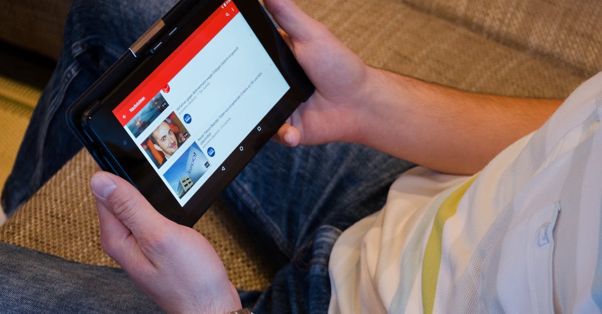 Internet connection for iPad in India - Person Holding Tablet Computer Showing Videos