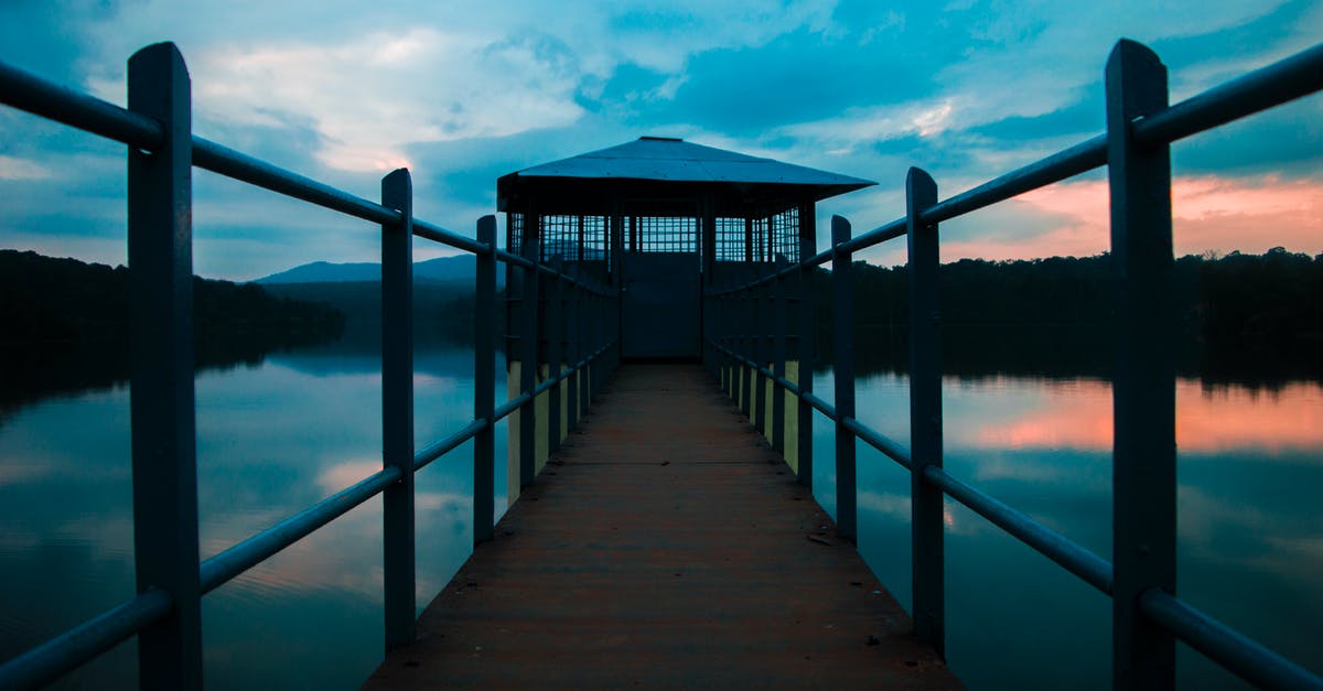 Interstate Karnataka Tamul Nadu permit charges - Brown Wooden Dock on Body of Water Under Cloudy Sky