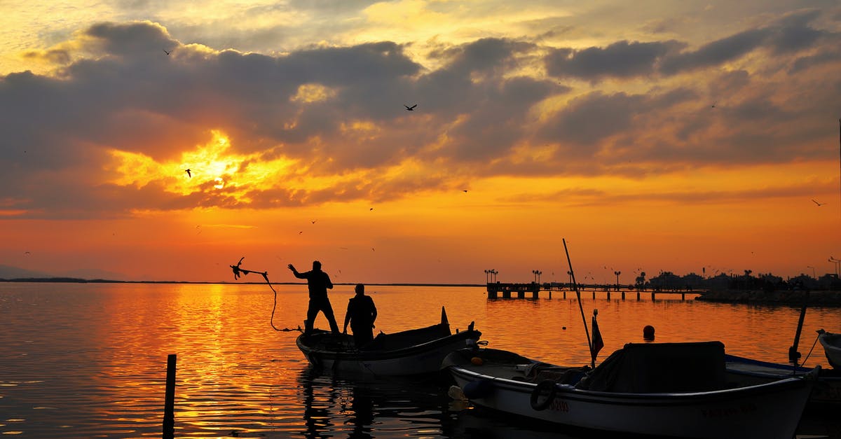 Is 1 hour 15 min layover sufficient at Bankgok airport? - Silhouette of 2 Person Riding on Boat during Sunset