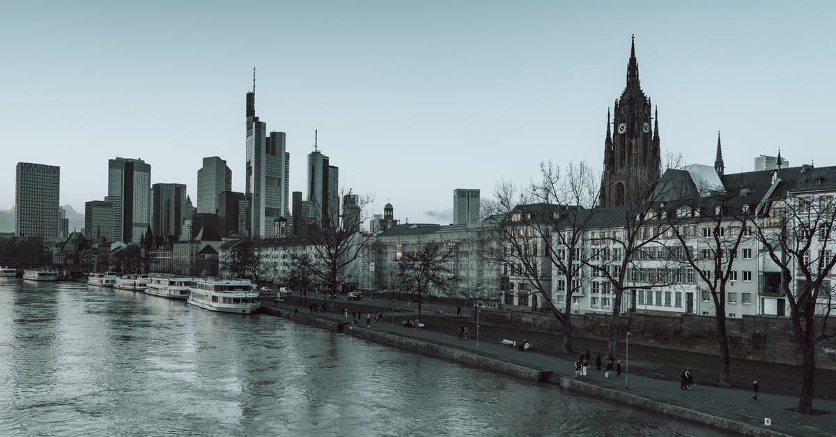 Is 1h25m enough to connect at Frankfurt am Main Airport? - Buildings Near a River with Ferry Boats