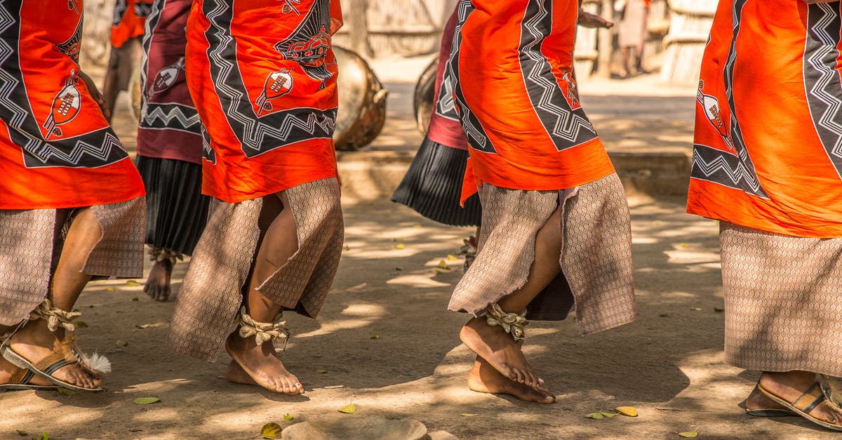 Is 1h 15m layover in Brisbane long enough? - Barefoot Legs of African Women Dancing Ceremonial Dance