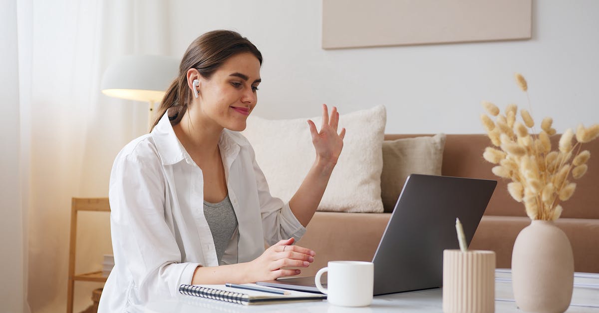 Is 'wai' greeting a serious thing? Is it inappropriate to 'over-wai'? - Cheerful woman having video call via laptop