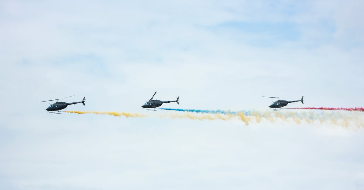 Is 6 weeks long enough to go from Lima, Peru to Buenos Aires? - From below of identical black helicopters with long tails and propellers flying in cloudy sky while leaving colorful wavy traces with smoke effect in daylight