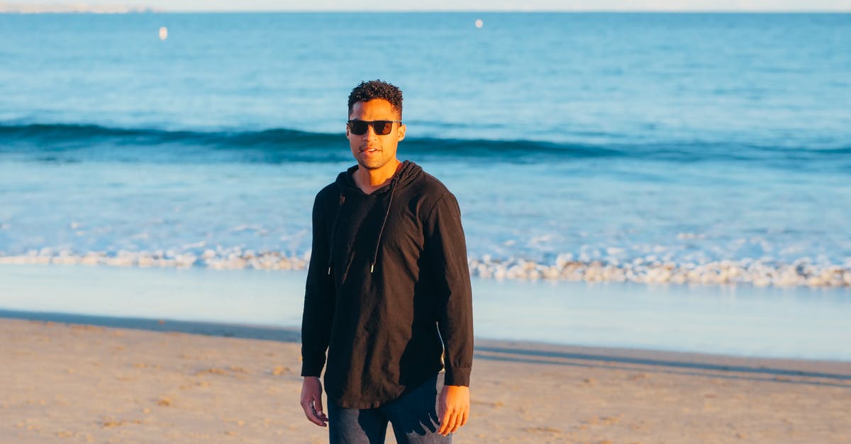 Is a 2-hour layover in Newark fine when traveling to Bombay? - Man Standing on Beach Sand