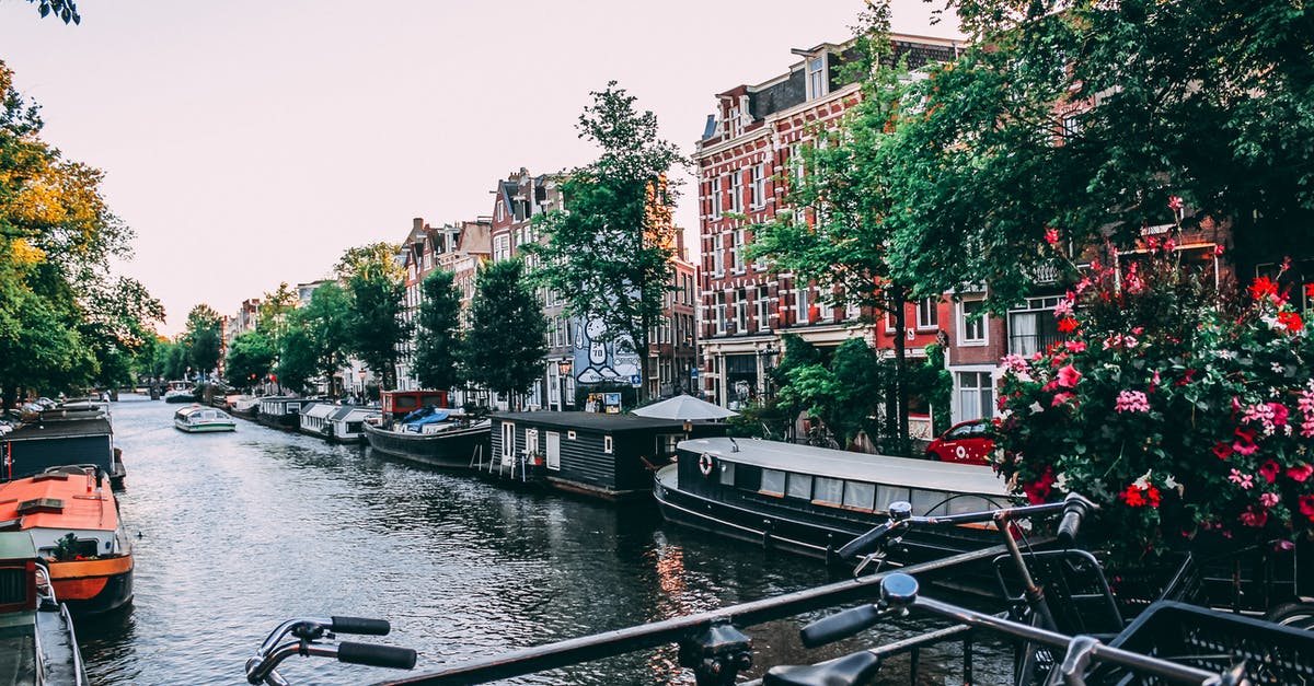 Is a 55 minute layover in Amsterdam enough to connect? - Three Bicycle Upright Parked on Bridge