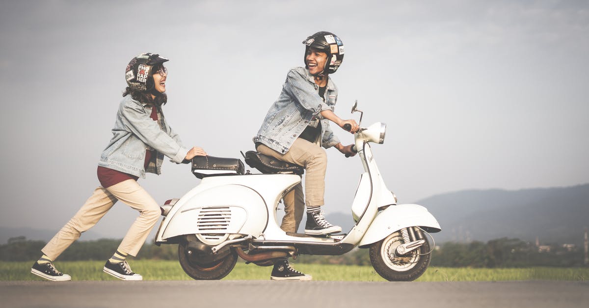 Is a driving licence needed to drive a scooter in Ibiza? - Woman Pushing A Scooter