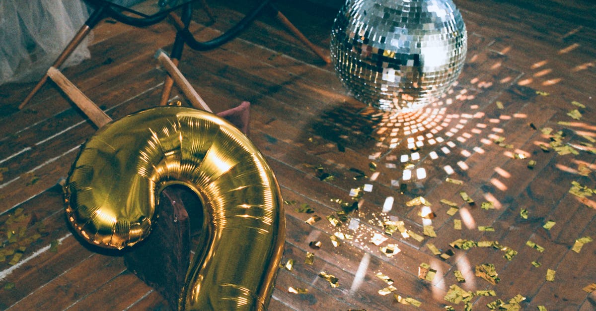 Is a two and half year Danish Residence Permit considered permanent? - Gold Number Two Balloon and Disco Ball on the Floor