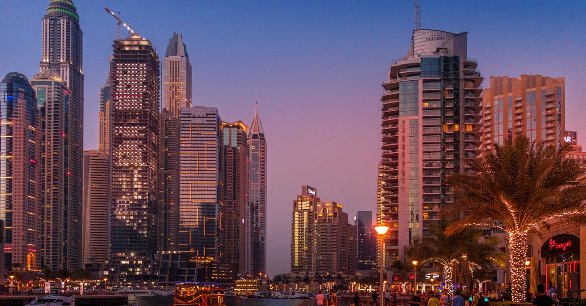 Is a UAE Tourist visa still valid after a change of passport number? - City Buildings during Sunset