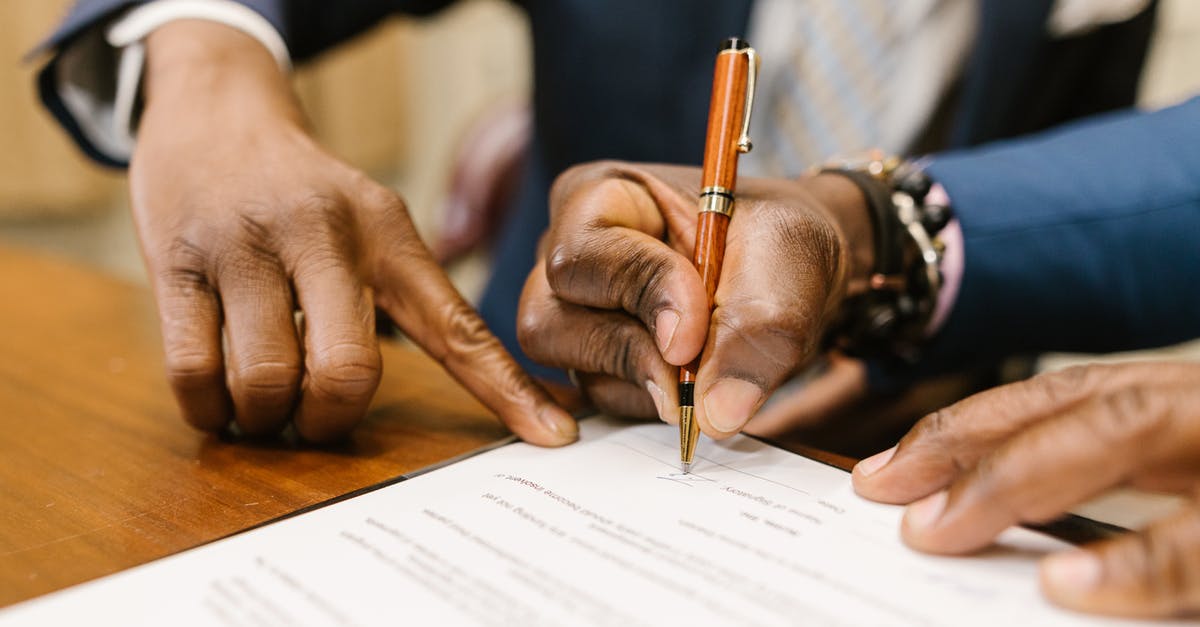 Is Adderall Legal in China? [closed] - Close-Up Shot of a Person Writing on a Contract