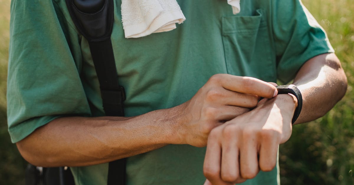 Is an E-ticket required to check-in? [closed] - Man in Green Polo Shirt Holding White Textile