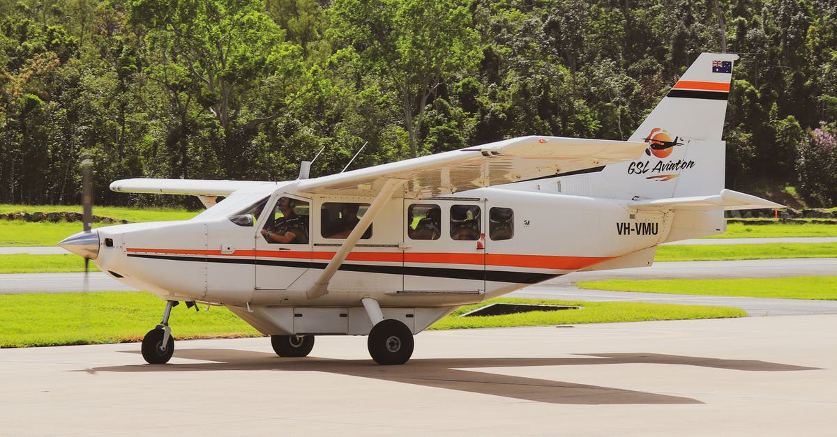 Is Bamako Mali airport safe? - White and Orange Airplane on Gray Concrete Road