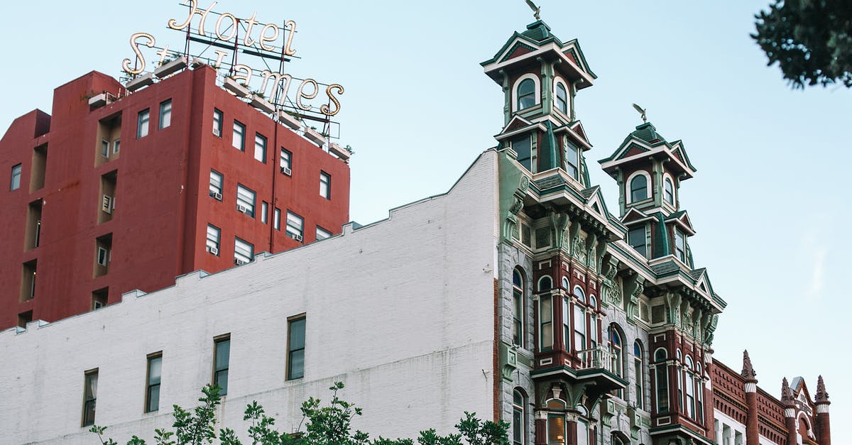 Is California a year-round destination? [closed] - From below of aged historic building with arched windows against cloudless blue sky in San Diego