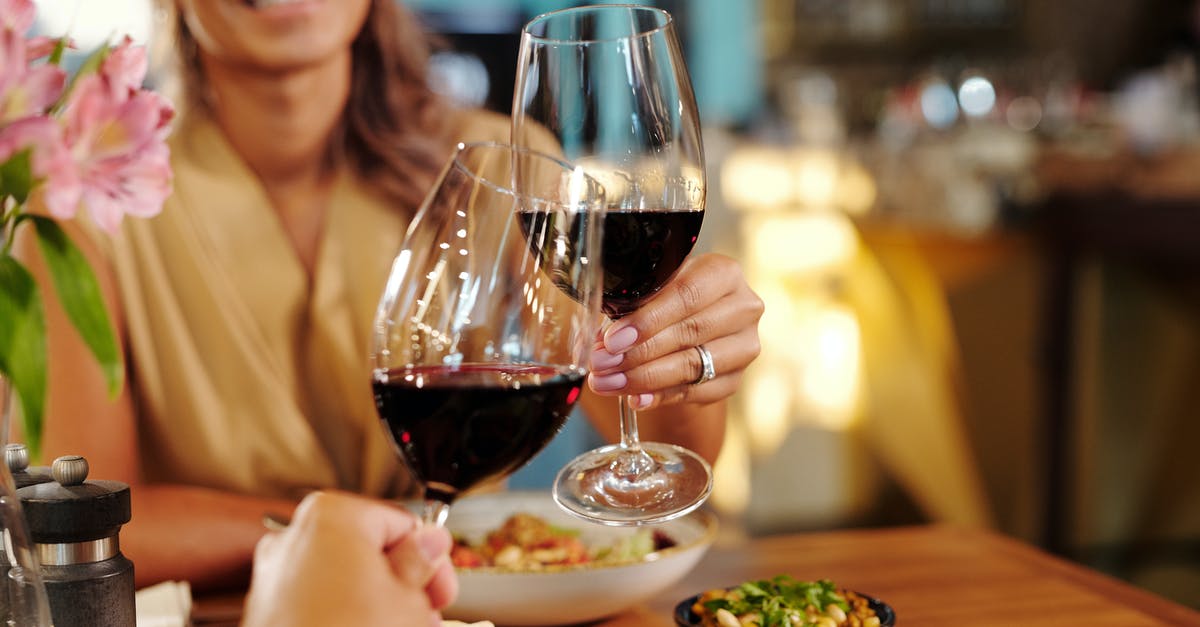 Is food in Rome's restaurants usually produced off-site then delivered? [closed] - Woman in Brown Blazer Holding Wine Glass