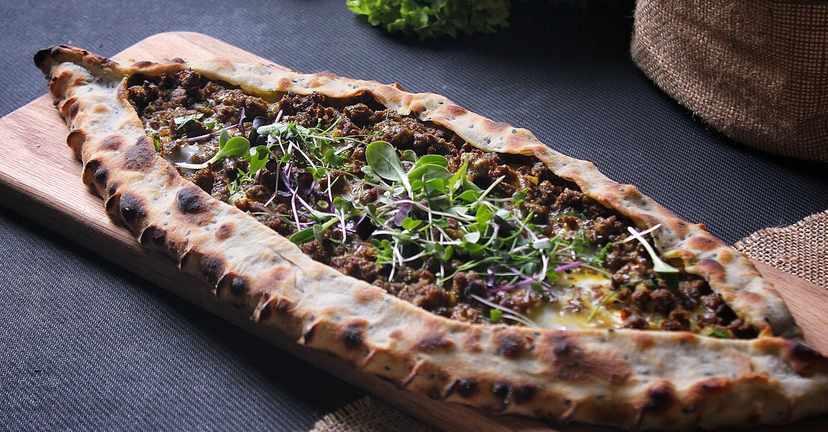 Is food in Rome's restaurants usually produced off-site then delivered? [closed] - Close-up of Italian Pizza on Board