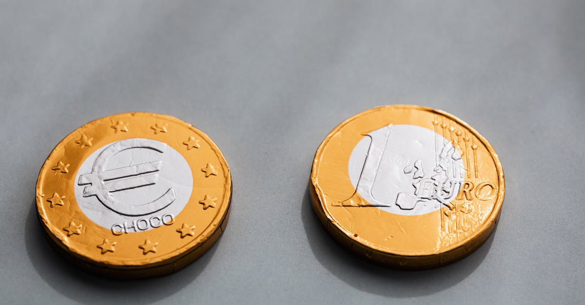 Is gold an acceptable means of currency exchange? - Coins one euros lying on gray table