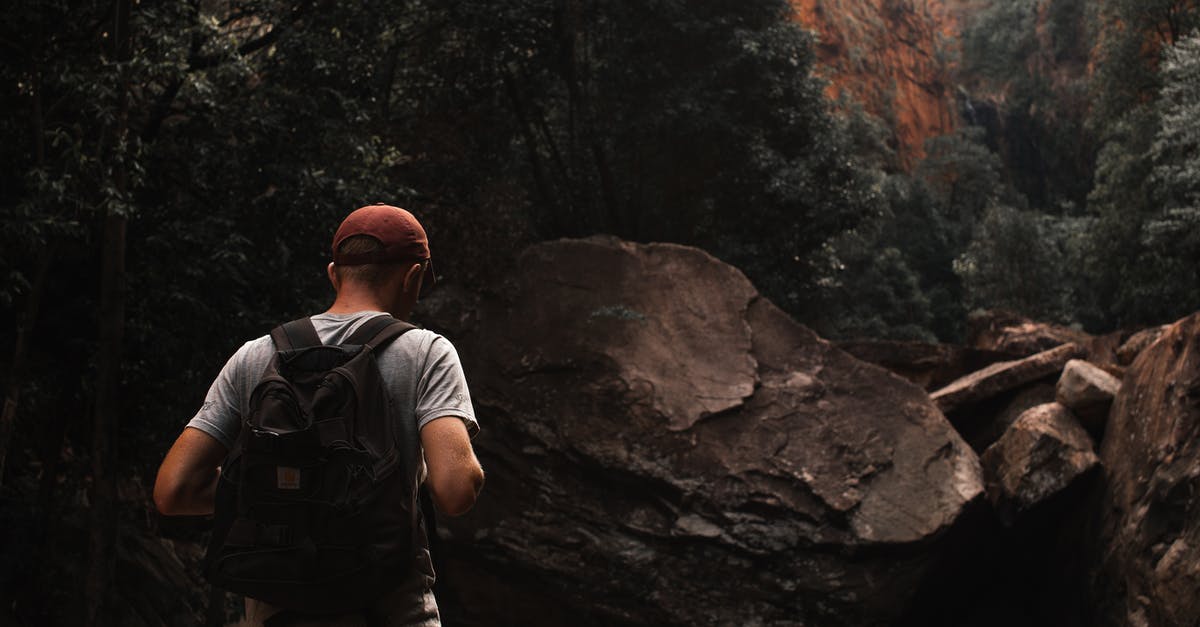 Is Grand Canyon Rim Trail longer than 5.4 mi? - Anonymous male backpacker exploring rocky mountains during hiking trip