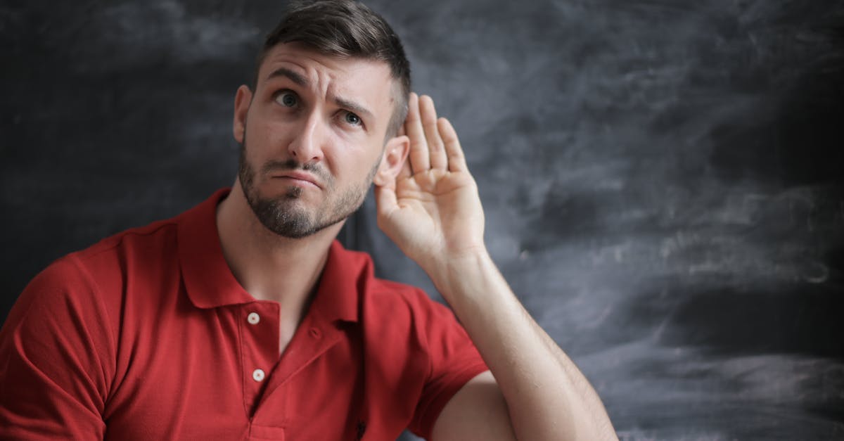 Is it a good idea to order a ticket for the London Eye in advance? - Man in Red Polo Shirt Sitting Near Chalkboard