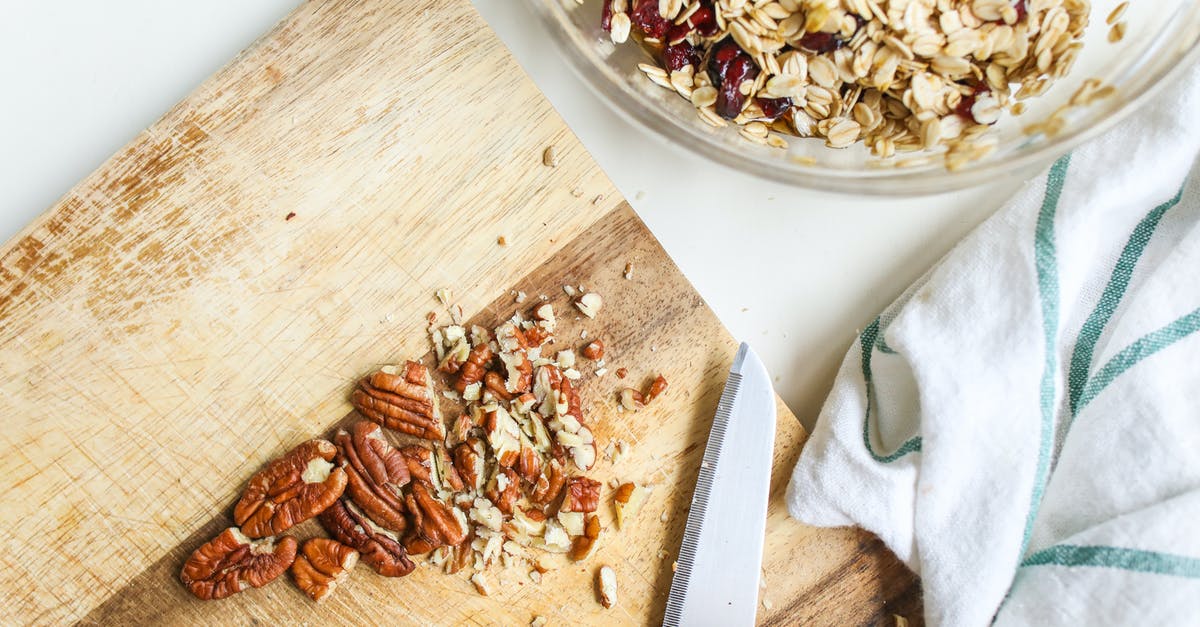 Is it allowed to bring nuts and raisins to Colombia? - Photo Of Chopped Pecans On Wooden Chopping Board