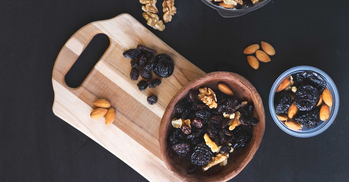 Is it allowed to bring nuts and raisins to Colombia? - Raisins and Nuts on Different Kinds of Bowl on the Black Surface