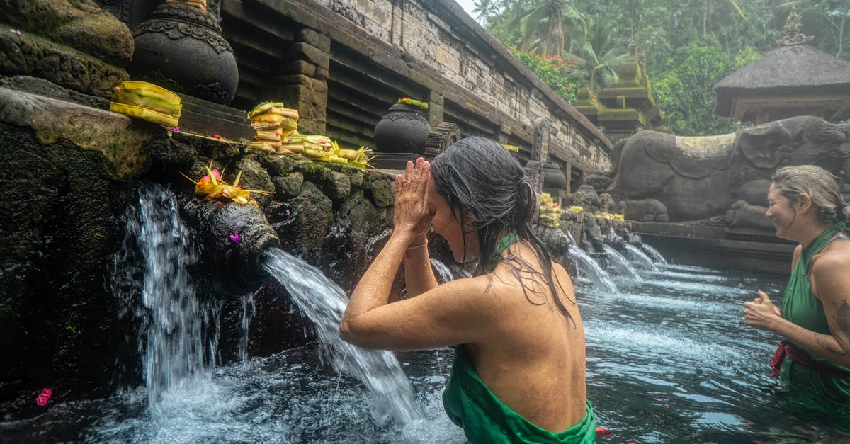 Is it appropriate to wear a knee-length yukata on summer festivals? - Woman Standing in Front of Flowing Water