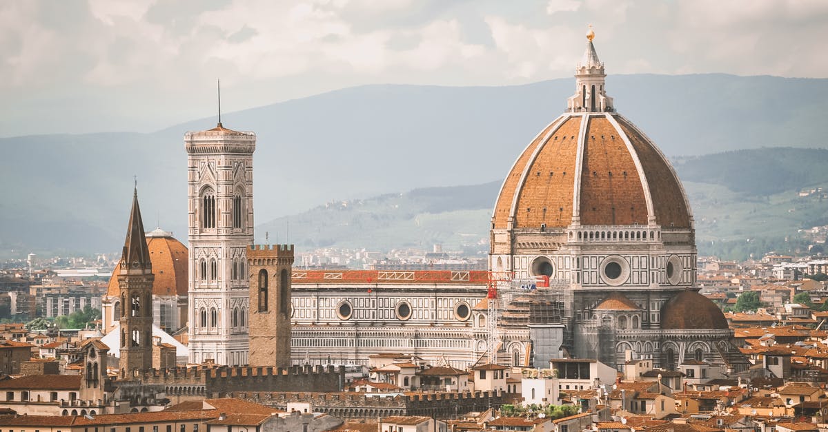 Is it common/accepted to bring a dog in Tuscany (Italy)? - Brown and White Concrete Building