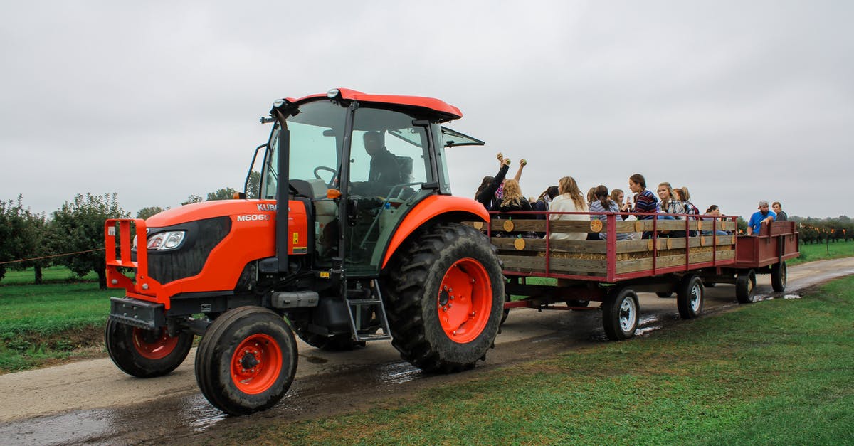 Is it feasible to visit the Yarra Valley by public transport? - Tractor with people visiting farmland in cart