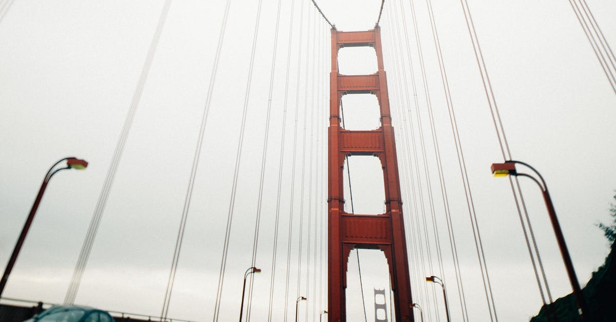 Is it illegal not to pass slow cars (USA)? - Long suspension bridge with moving cars on cloudy day