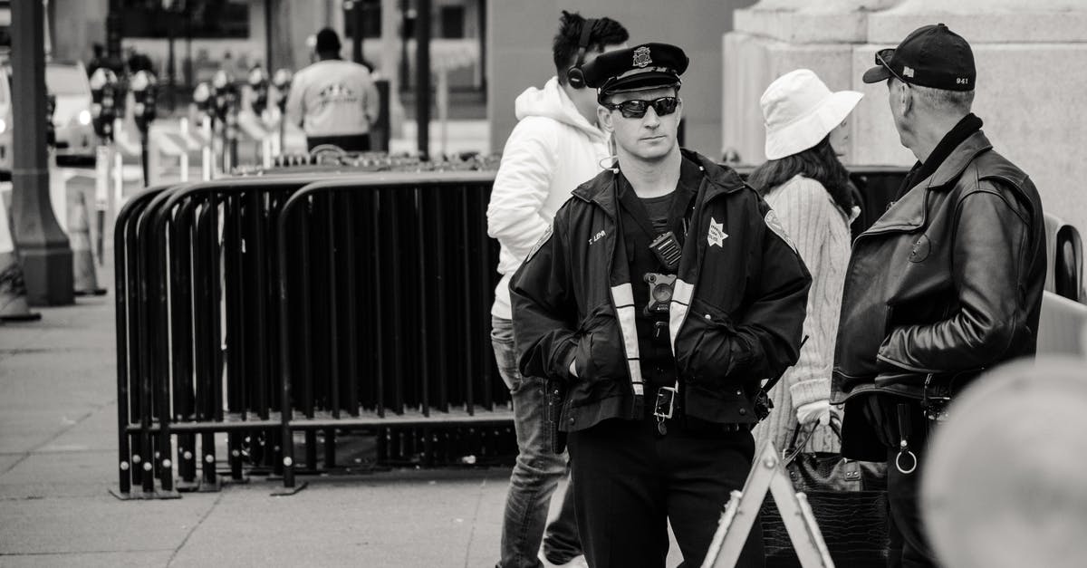 Is it legal in Spain for a male airport security guard to ask you to lift up your blouse and swab your bare stomach? - Man Wearing Jacket and Peaked Cap Grayscale Photo Is it legal in Spain for a male airport security guard to ask you to lift up your blouse and swab your bare stomach? - Man Wearing Jacket and Peaked Cap Grayscale Photo