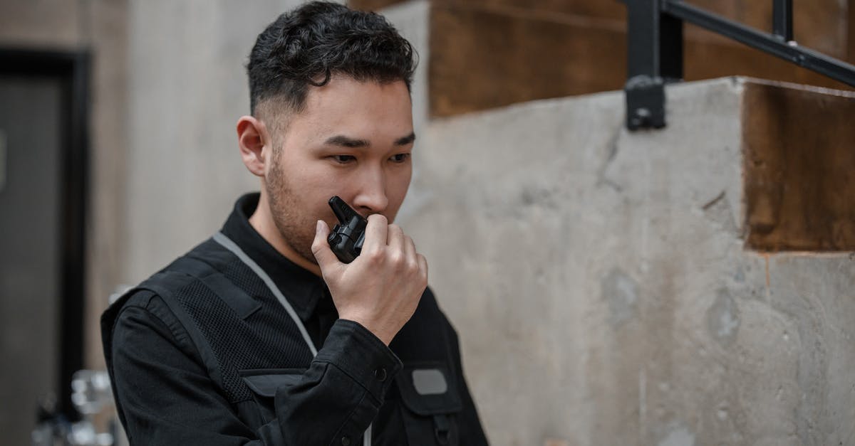 Is it legal in Spain for a male airport security guard to ask you to lift up your blouse and swab your bare stomach? - A Man Talking on a Walkie Talkie Is it legal in Spain for a male airport security guard to ask you to lift up your blouse and swab your bare stomach? - A Man Talking on a Walkie Talkie