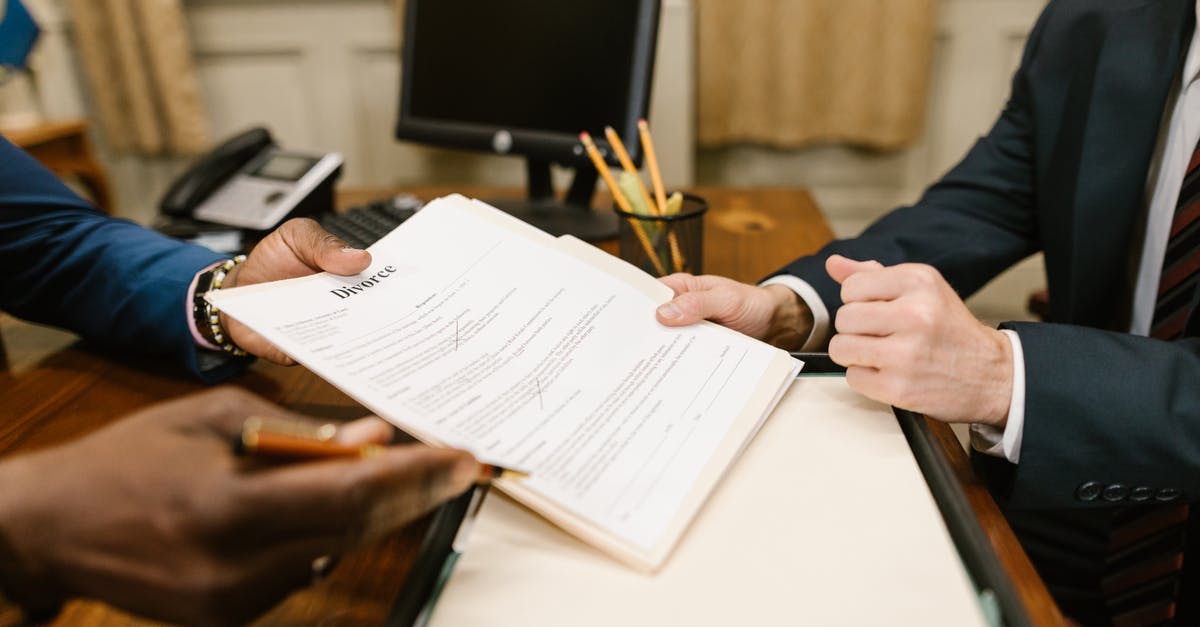 Is it legal to ask for my information? [closed] - Close-Up Shot of a Person Holding Divorce Papers