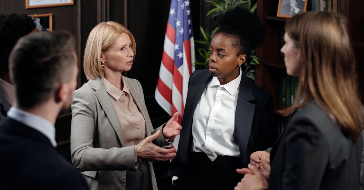 Is it legal to meet with potential future employers in the UK, whilst visiting from the USA - Businesspeople having a Meeting Is it legal to meet with potential future employers in the UK, whilst visiting from the USA - Businesspeople having a Meeting