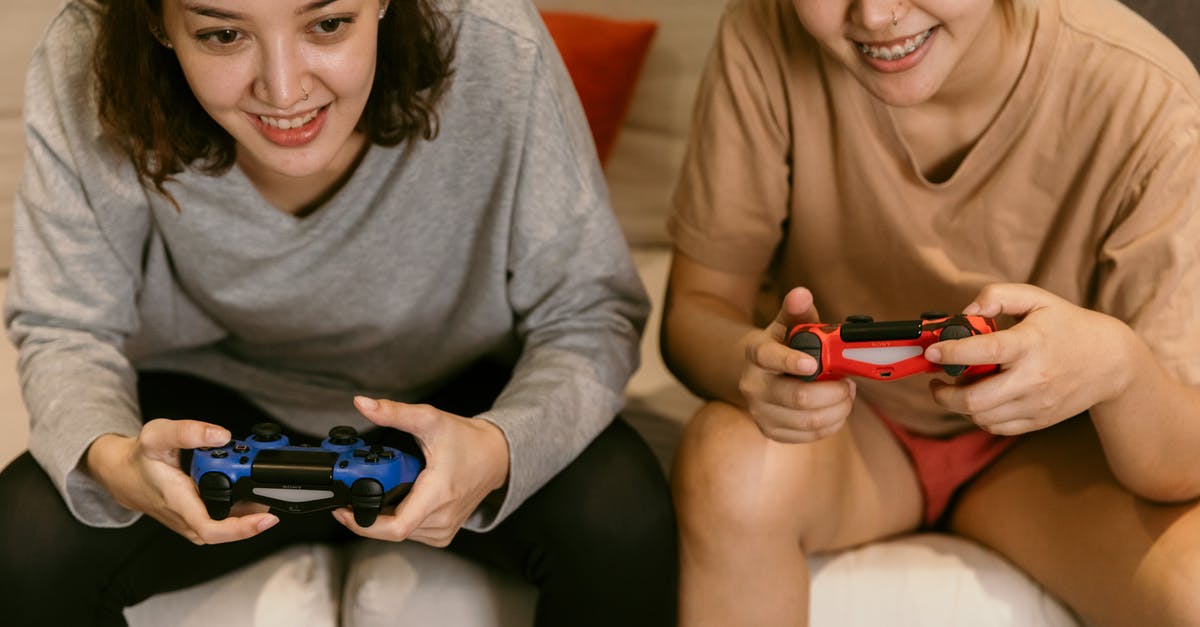 Is it ok to provide match tickets from third party sites - Crop Asian girlfriends playing video games at home