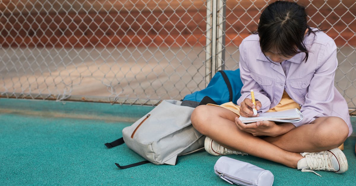 Is it okay to wear a pouch when flying? - Girl in Purple Jacket Sitting Writing on Her Notebook