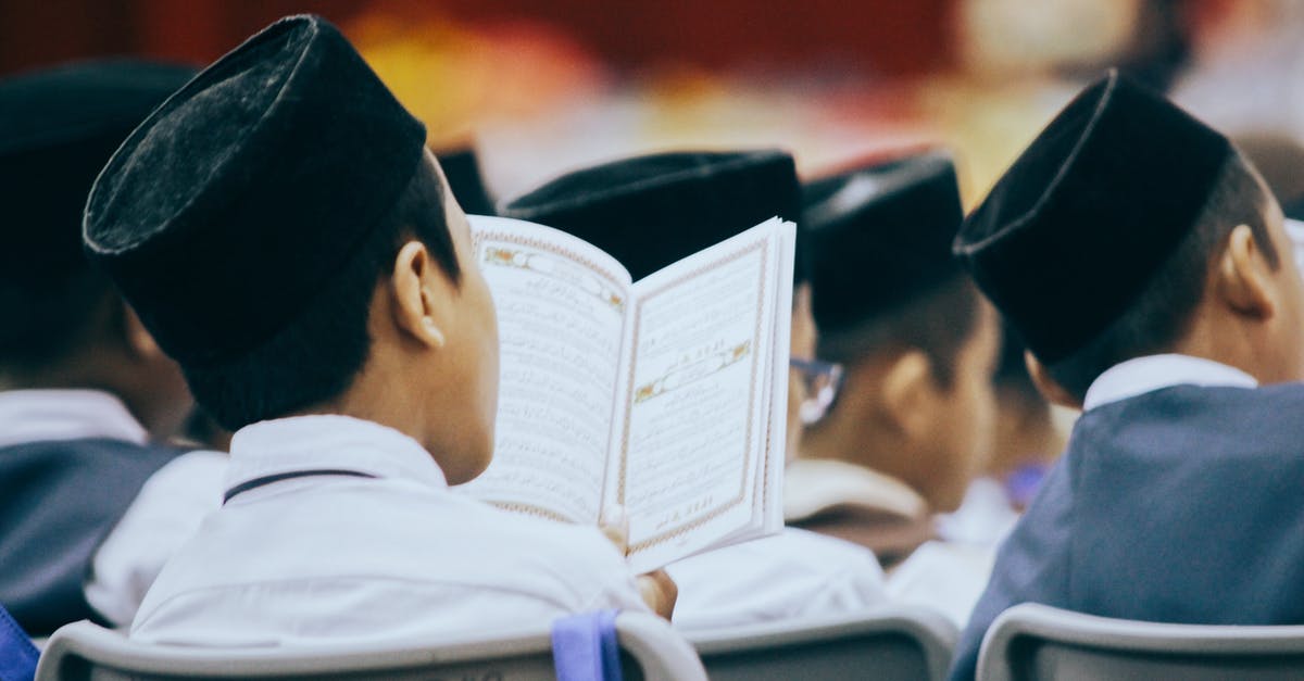 Is it possible to book adjacent seats on a NightJet train? - Photo Of Person Reading Quran 