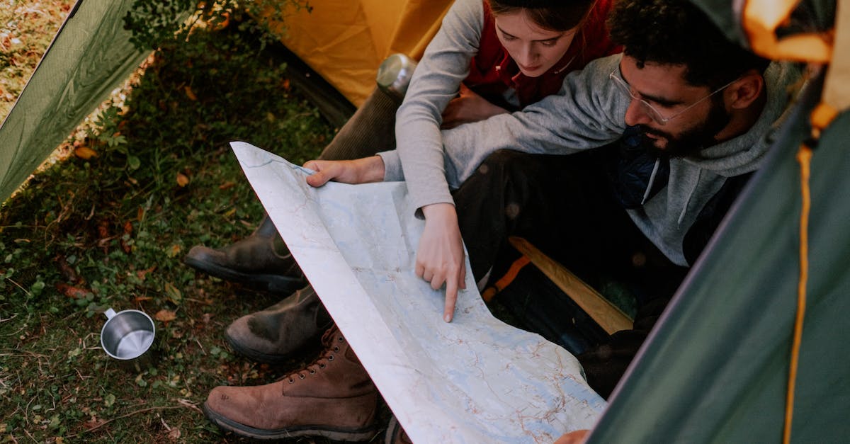 Is it possible to camp in Russia on a tourist visa? - Couple Looking at a Map Together