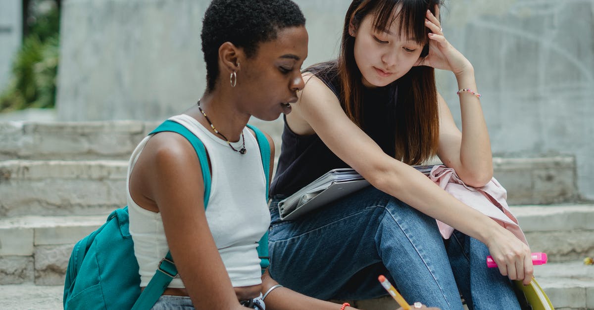 Is it possible to get a Canadian visa without concrete plans? - Thoughtful diverse female students on staircase