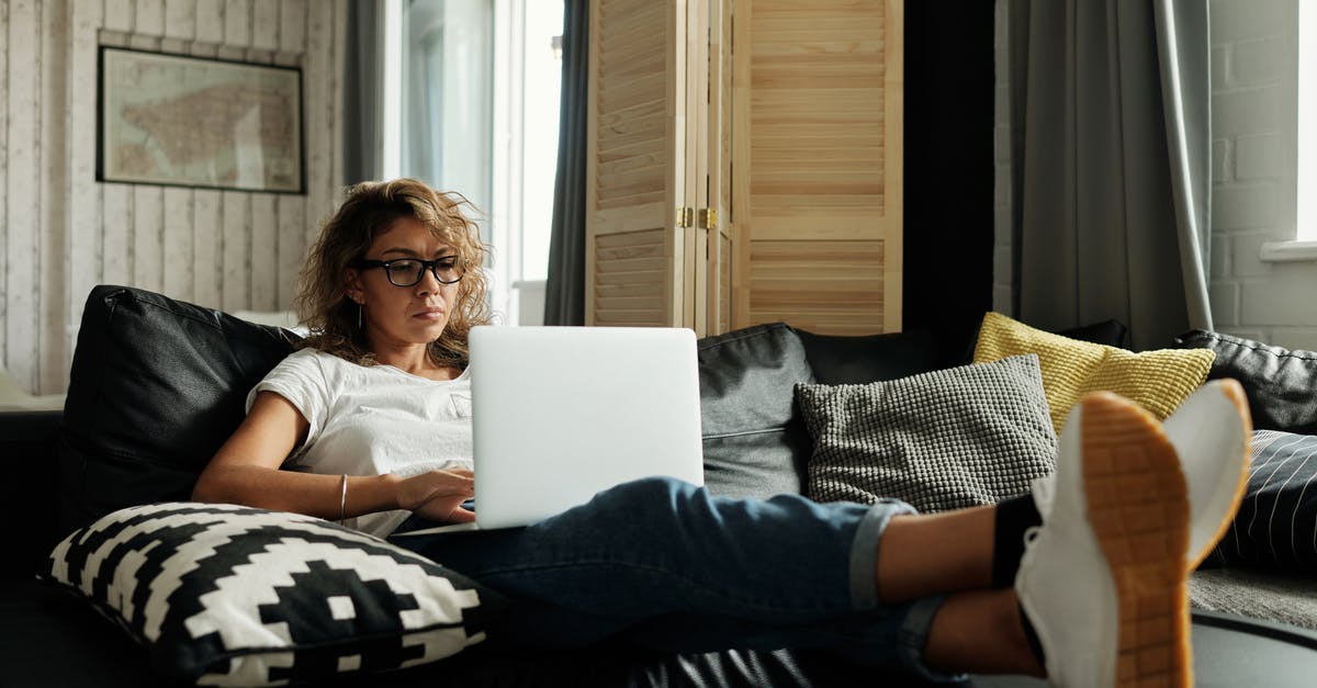 Is it possible to get an immigration visa (to stay as long as possible) to US while working remotely for a company in another country? [closed] - Photo Of Woman Sitting On A Couch