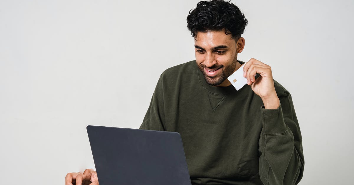 Is it possible to get an Oyster card refund online? - Man Holding His Credit Card