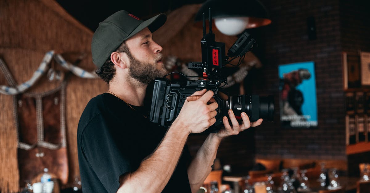 Is it possible to hire a tour guy through Iraq with a film crew for a documentary film on Iraq ancient history? - A Bearded Man Wearing Black Shirt while Filming Is it possible to hire a tour guy through Iraq with a film crew for a documentary film on Iraq ancient history? - A Bearded Man Wearing Black Shirt while Filming