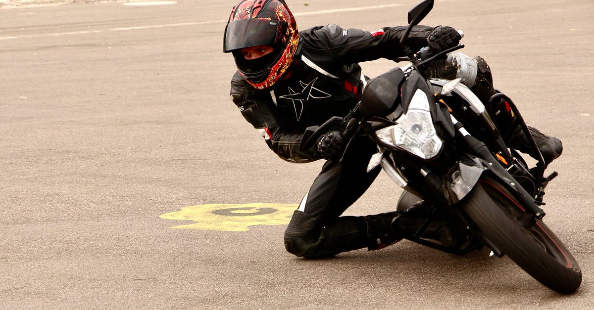 Is it possible to motorcycle through Southeast Asia? [closed] - Close-Up Shot of a Person Riding a Motorcycle