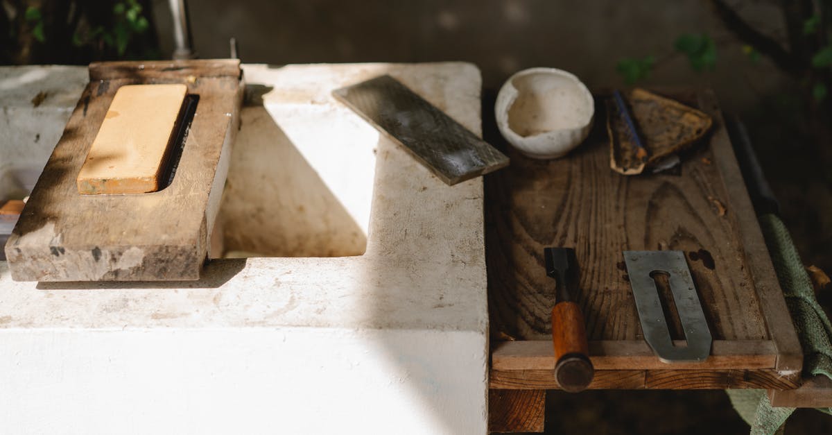 Is it possible to take a soldering iron aboard an airplane? - Assorted carpentry instruments on old washbasin outdoors