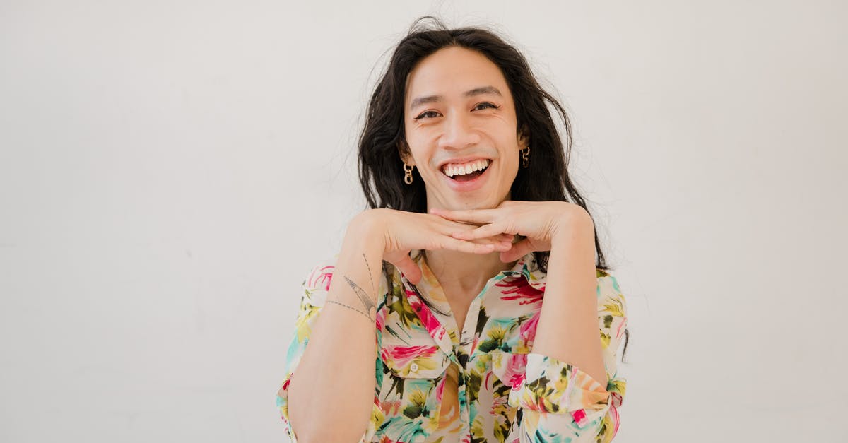 Is it possible to travel between India and China by rail? - Smiling Girl in Yellow Pink and Green Floral Shirt