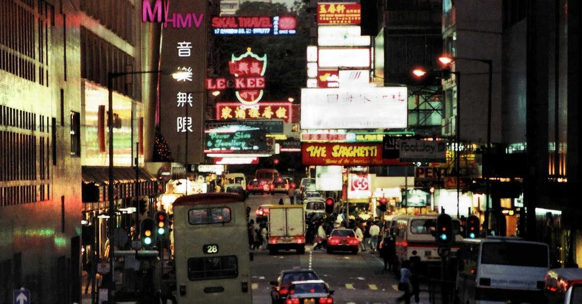 Is it possible to walk between Kowloon and Hong Kong Island? - A Busy Street in Hong Kong at Night